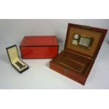 A vintage Dunhill burr maple and ruby laquered humidor box, 15cm high, 36cm wide; together with a