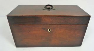 A George III mahogany tea caddy, with two internal lidded cannisters and a well for a mixing bowl (
