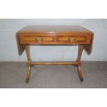 A Regency style yew veneered sofa table, 20th century, 76cm high, 92cm wide (closed); together