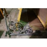 A large wrought iron coaching inn or shop swing sign bracket, early 20th century, with scrolled