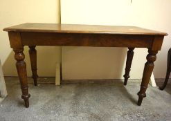 A Victorian mahogany side table, with rounded corners, on turned legs, 74cm high, 129cm wide