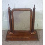 A Victorian mahogany dressing table swing mirror, with plain turned supports and a platform base,