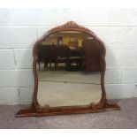 A George III style overmantel mirror, of arched form, 99cm high, 116cm wide