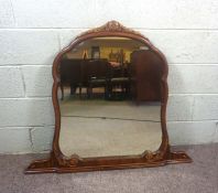 A George III style overmantel mirror, of arched form, 99cm high, 116cm wide