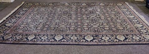 A large modern Mahal style carpet, late 20th century, decorated with multiple flower heads on a dark