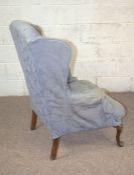 A George III style wing armchair, with cabriole legs; together with a small oval dressing table
