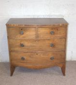 A George IV mahogany bowfront chest of drawers, of smaller size, with two short and two long