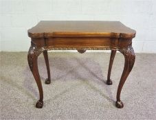 A George II style mahogany concertina tea table, 20th century reproduction, with foldover top, on