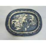 A very large blue and white ‘Willow Pattern’ meat ashet or platter, stamped ‘Best Goode’, 54cm wide;