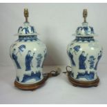 A pair of Chinese blue and white porcelain table lamps, late 20th century, in the KangXi style, of