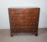 A Victorian mahogany chest of drawers, circa 1840, with two short and three long drawers, on bracket