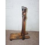 A 19th century boot jack, with turned supports and hinged boot 'lock', 78cm high