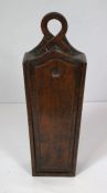A 19th century fruitwood candle box, with moulded sliding top and 'knot' suspension loop, 40cm high,