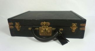 A vintage Louis Vuitton black leather briefcase, stamped and signed Louis Vuitton, Paris, serial