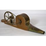A vintage brass hand wound bellows, on wooden base, 60cm long; together with a small oak pipe rack