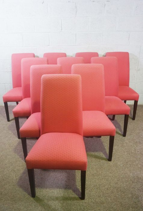 A set of ten modern beech framed dining chairs, with scrolled over and upholstered backs,