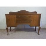 A modern beech sideboard, 110cm high, 150cm wide; together with a matching dressing table, 76cm