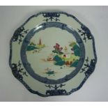 A large Chinese famille verte and blue and white charger, Qing Dynasty, the lobed dished plate