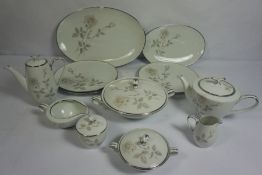 A large porcelain dinner service, including tea wares and related, and a small quantity of silver