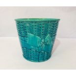 A Minton’s majolica waste paper basket, in aquamarine blue ground, with ‘weaved decoration, signed