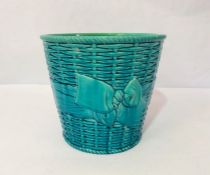A Minton’s majolica waste paper basket, in aquamarine blue ground, with ‘weaved decoration, signed