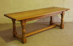 A large oak Jacobean style refectory dining table, modern, 20th century, with a plain planked top on