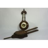 A late Victorian aneroid barometer and thermometer, in an carved case; together with a pair of oak