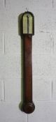 A George III mahogany cased stick barometer, signed F.W.Field, Aylesbury, with a silvered dial