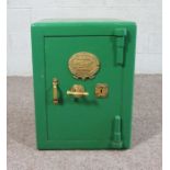 A cast iron safe, by F Grove & Son, with keys, painted green, 62cm high, 47cm wide, 45cm deep