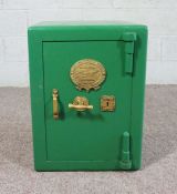 A cast iron safe, by F Grove & Son, with keys, painted green, 62cm high, 47cm wide, 45cm deep