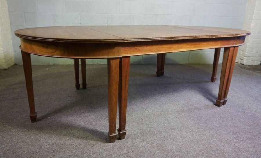 A vintage oak extending dining or serving table, (used as a textile cutting table a famous