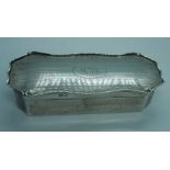 A silver trinket or pin box, Elkington & Co, Birmingham 1904, 12cm long; together with a group of