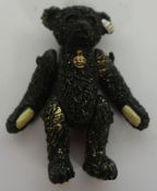 A Steiff miniature 'Titanic - Mourning Bear - 1912', replica, metal alloy with articulated limbs and