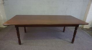 A large modern 'mahogany' dining table, 20th century, with a rounded rectangular top on four