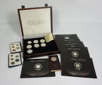 A small group of Royal Mint collectors coins, including a cased set of H.M. The Queen Elizabeth, The