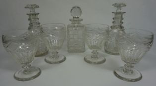 A pair of early 19th century glass mallet decanters, together with a set of four rummers, with