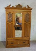 An Edwardian satin birch wardrobe, with mirrored door and single long drawer, 210cm high
