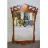 A George III style fretwork wall mirror, with inlays, 90cm x 50cm; together with two other modern