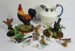 A selection of ceramics, including a large decorative cockerell, assorted other bird figurines, a