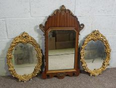 A George II style wall mirror and two small composition gilt framed mirrors; together with a pair of