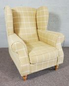 A Yellow and cream check upholstered wing armchair, modern, 111cm high; together with a pair of