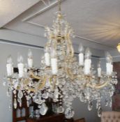 A large cut glass crystal two tiered eighteen light chandelier, 20th century, the central stem