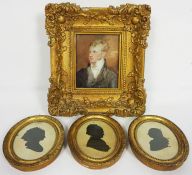 A set of three 19th century silhouettes, each depicting the head of a lady, in oval gilt frames,