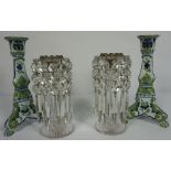 A pair of clear cut glass table lustre candlesticks, 21cm high; together with a pair of