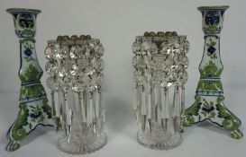 A pair of clear cut glass table lustre candlesticks, 21cm high; together with a pair of