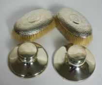 Two silver capstan inkwells, both hallmarked Birmingham, marks rubbed, of typical form, one with