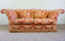 A large red damask covered sofa, with wide flared arms and separate cushions, 210cm wide