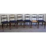 A set of six Regency simulated rosewood ‘Trafalgar’ dining chairs, early 19th century, each with a