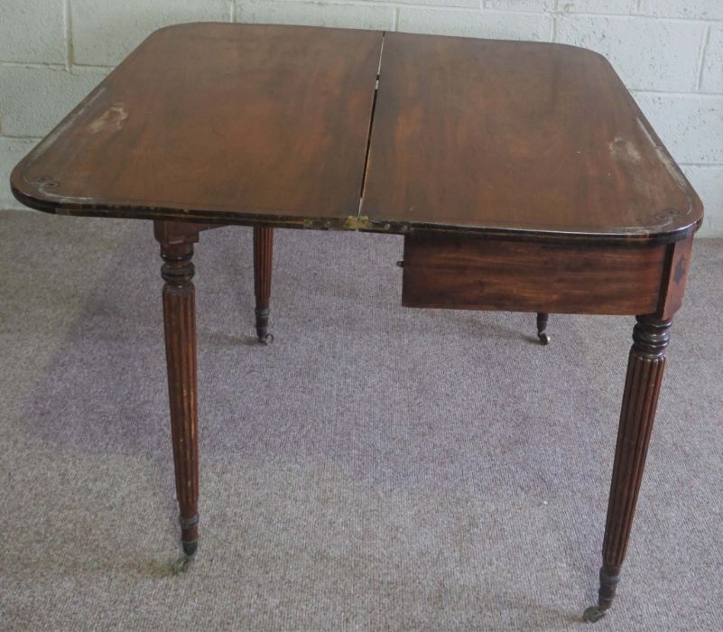 A Regency mahogany tea table, circa 1820, with rounded rectangular fold over top and set on four - Bild 4 aus 7