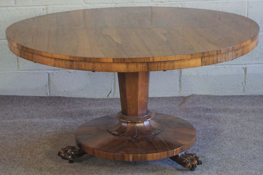 A William IV rosewood breakfast table, circa 1830, with a round tilt top set on an octagonal tapered